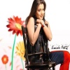 Amisha On Chair Bollywood 400x300